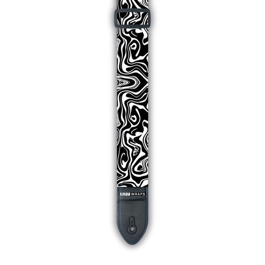 A black and white padded guitar strap with a swirl pattern.