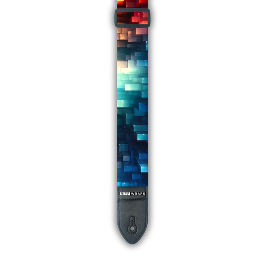 A padded guitar strap with a geometric and futuristic pattern in multiple colors.