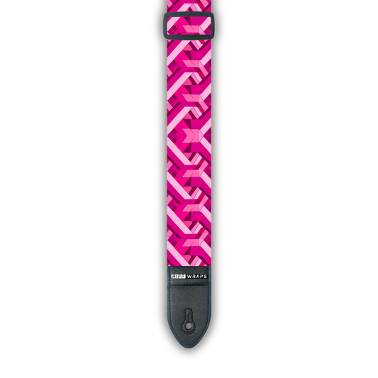 A pink and white geometric goyard pattern padded guitar strap with a brand logo.