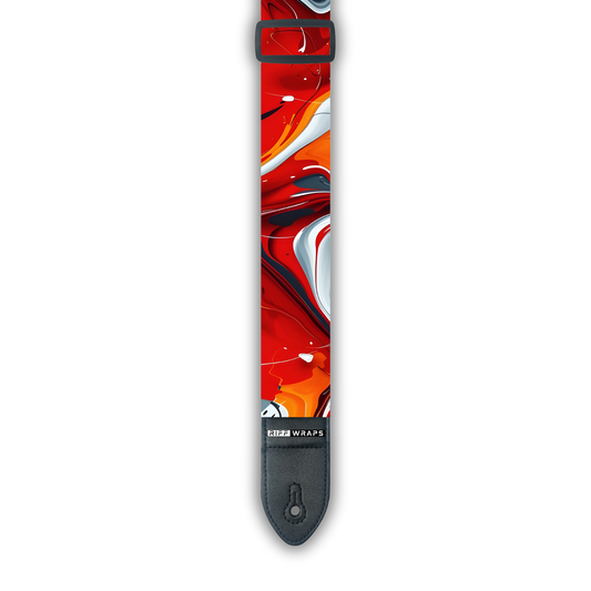 A padded guitar strap with a red, white, and grey swirl pattern, featuring a buckle and adjustment parts.