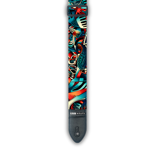 A padded guitar strap with a colorful tribal and abstract pattern.