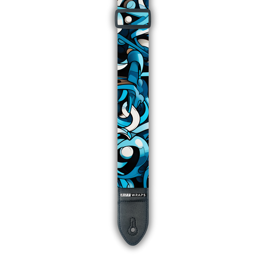 A padded guitar strap with an abstract blue and white pattern, showing the brand logo 'Riff Wraps' at the end.
